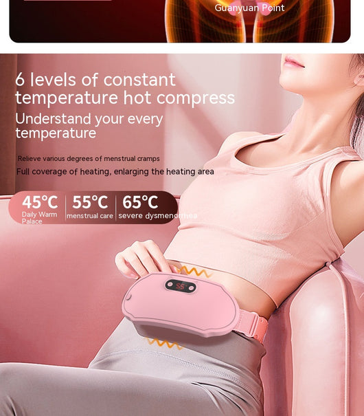 Pink stomach warming belt with vibration and heating, USB charging cable, two wormwood bags, and manual in a floral gift box. - Image 13