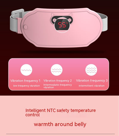 Pink stomach warming belt with vibration and heating, USB charging cable, two wormwood bags, and manual in a floral gift box. - Image 32