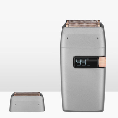 Silver electric shaver with a rose gold power button and LCD display showing '99', next to a replacement shaver head. - Image 9