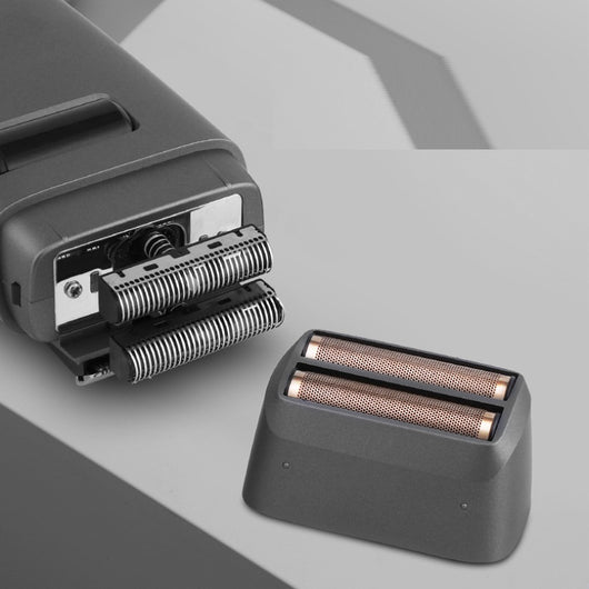 Silver electric shaver with a rose gold power button and LCD display showing '99', next to a replacement shaver head. - Image 11