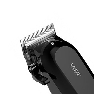 Black electric hair clipper with LCD display showing '100', multiple guide combs, cleaning brush, oil, comb, and USB cable. - Image 14