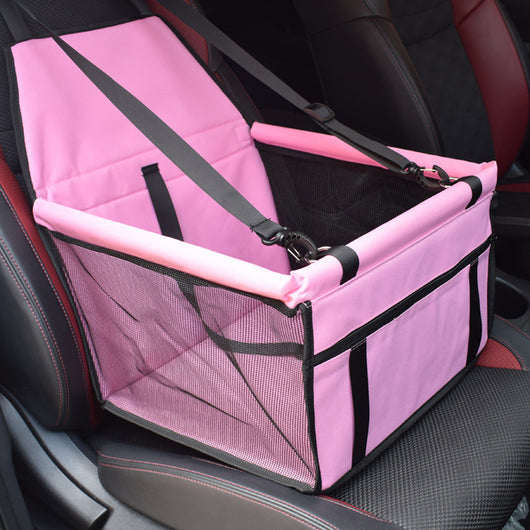 Light grey pet car booster seat with black mesh sides and adjustable straps, installed on a black and red car seat. - Image 15
