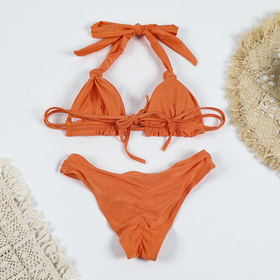 Orange pure color bikini with knotted halter top and banded thong bottoms, displayed flat on a white background. - Image 27
