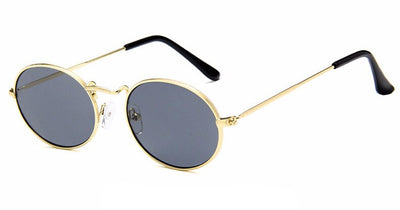 Retro round sunglasses with pink lenses and a gold-colored metal frame, featuring black ear tips. - Image 9