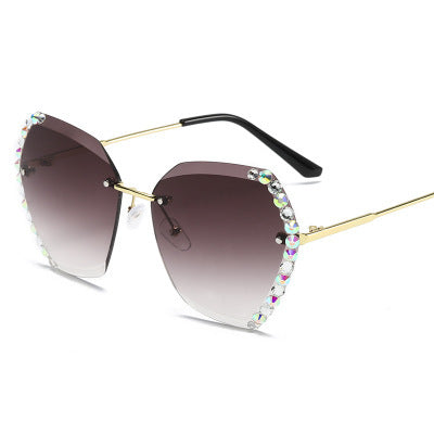 Women's rimless sunglasses with gradient gray lenses, gold-tone metal arms, and iridescent rhinestone embellishments. - Image 9