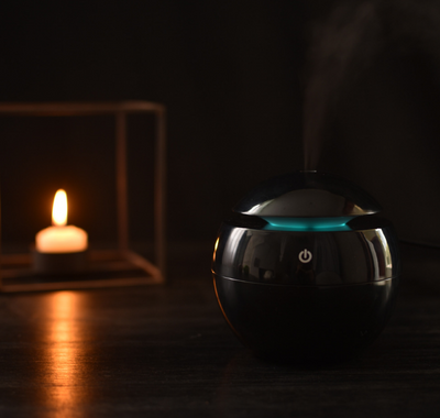 Black spherical ultrasonic atomizer with a power button icon, designed for aromatherapy and humidification. - Image 6