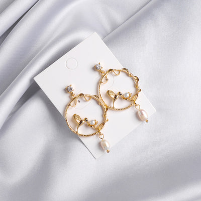 Aretes de perla con rama circular - Diseño elegante y minimalista - Image 6