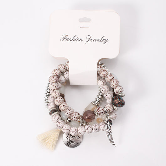 Pulsera Cristal Piedra Volcánica Multicapa con Borla Ala para Mujer - Image 6