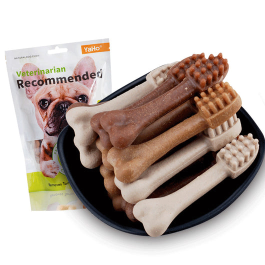 YaHo bone-shaped dog snacks in various brown and tan shades, some with dental nubs, in a black bowl. - Image 3