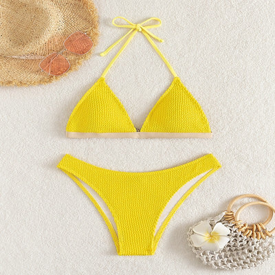 Bright yellow textured two-piece bikini with a triangle top and high-cut bottom, modeled on a person. - Image 7