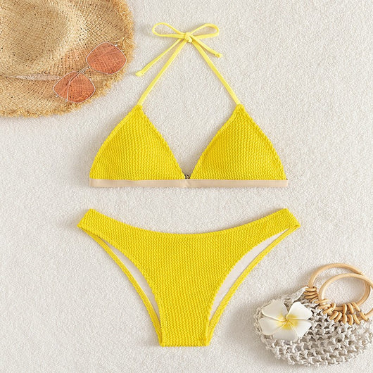 Bright yellow textured two-piece bikini with a triangle top and high-cut bottom, modeled on a person. - Image 7