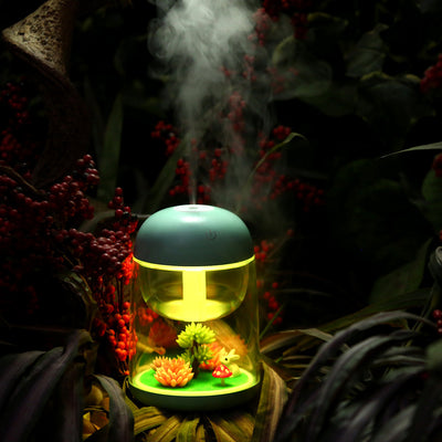 Pink and clear columnar humidifier with a micro landscape inside, featuring a white rabbit, red mushroom, and artificial plants. - Image 3
