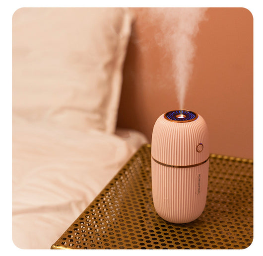 Navy blue portable humidifier with a ribbed texture, silver accents, and a power button on a white background. - Image 3
