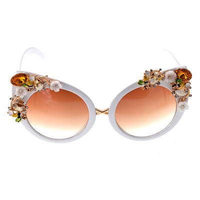 White cat-eye sunglasses with brown gradient lenses, adorned with clear and amber rhinestone flowers and bees. - Image 7