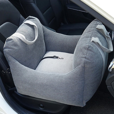 Beige pet car carrier seat with tan straps and a separate red pet seatbelt leash for safe car travel. - Image 6