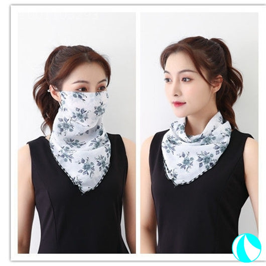 White women's UV protection scarf with black speckle pattern, worn as a face mask and neck scarf. - Image 8