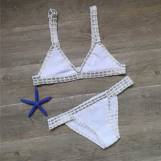 Pink crocheted bikini with silver knitted stitching, featuring a triangle top and matching bottom, laid flat. - Image 9