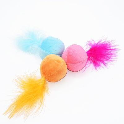Pink plush ball cat toy with bright fuchsia feathers on top, designed to entice cats for playful interaction. - Image 2