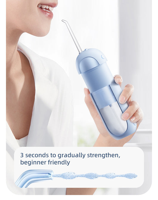 White portable electric dental water flosser with a clear nozzle and retractable water tank for oral hygiene. - Image 25