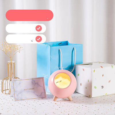 Pink spherical sleeping light with a sleeping cat design, wooden legs, and soft glow, displayed with gift packaging. - Image 5