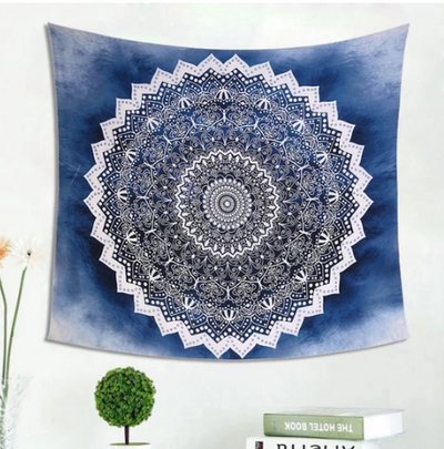 Cool blue mandala tapestry with intricate white patterns, perfect for wall hanging in a dorm room or living space.