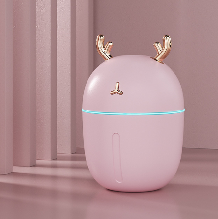 Pink deer-shaped mini humidifier with gold antlers and a glowing blue light band, on a pink background. - Image 11