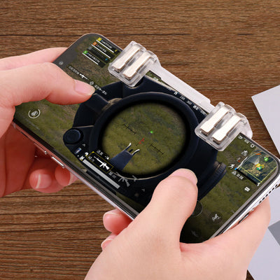 Transparent six-finger telescopic gaming trigger attached to a smartphone displaying a battle royale game. - Image 4