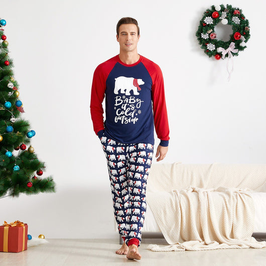 Child wearing dark blue and red Christmas pajamas with polar bear print and "Baby it's cold outside" text. - Image 4