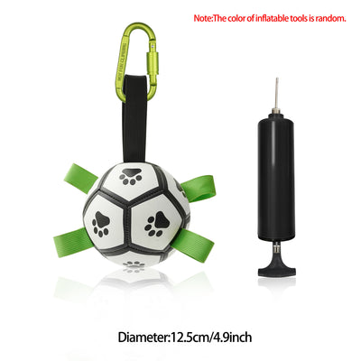 Interactive dog football toy with black and white panels, paw prints, green nylon tabs, and a green carabiner clip. Includes a black inflation pump. - Image 84