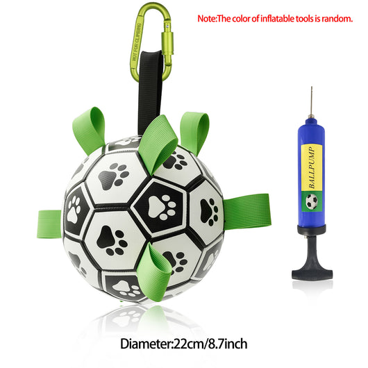 Interactive dog football toy with black and white panels, paw prints, green nylon tabs, and a green carabiner clip. Includes a black inflation pump. - Image 86