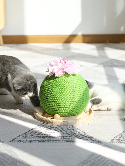 Green rope cat scratching toy shaped like a cactus with a pink flower on top, sitting on a light wood base. - Image 4