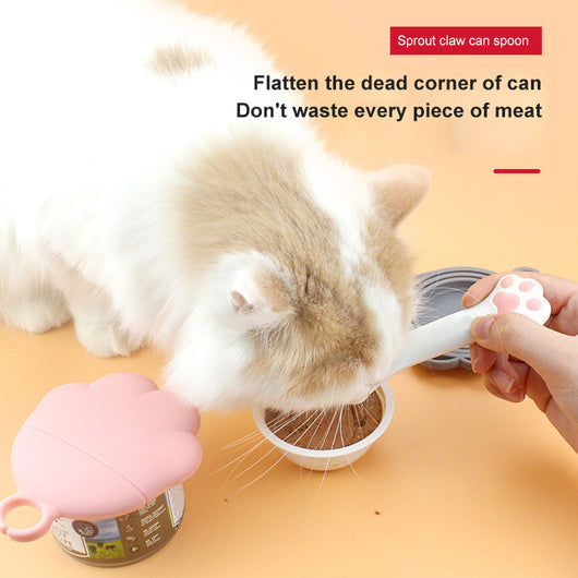 Gray pet food spoon with a paw print handle and a matching paw-shaped can opener lid. - Image 2