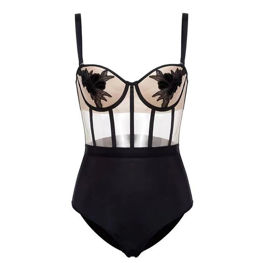 Black and nude lace bodysuit with floral embroidery, mesh panels, underwire cups, and adjustable straps.