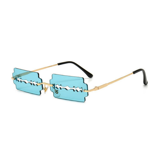 Orange razor blade shaped rimless sunglasses with gold metal frames and black ear tips on a white background. - Image 3
