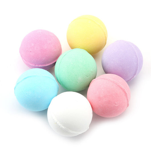 A single, round, light green bath bomb with a slightly textured surface, ready for a relaxing bath. - Image 2