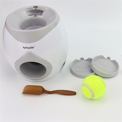White and grey automatic tennis ball launcher for dogs, dispensing food, with a tennis ball and kibble bowl. - Image 8