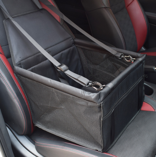 Light grey pet car booster seat with black mesh sides and adjustable straps, installed on a black and red car seat. - Image 4