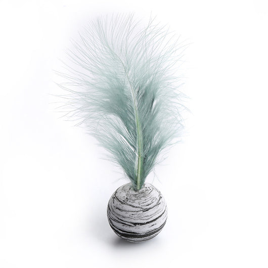 White foam cat toy ball with blue swirl patterns and a light blue feather on top, for feline play. - Image 12