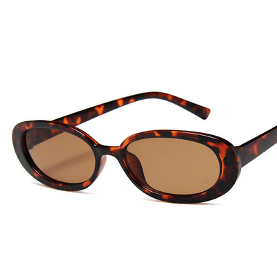 Small frame oval sunglasses with a tortoiseshell pattern and brown lenses on a white background. - Image 7