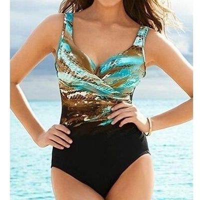 Women's one-piece swimsuit with a black bottom and a blue, brown, and white abstract patterned, ruched V-neck top.