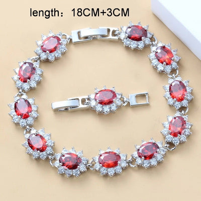 Four-piece jewelry set with silver-tone settings, featuring oval purple cubic zirconia stones surrounded by clear accents. - Image 17