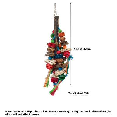 Hanging parrot toy made from natural wood, corn husk, and nuts with colorful strings and beads. A small yellow bird perches on the toy. - Image 6