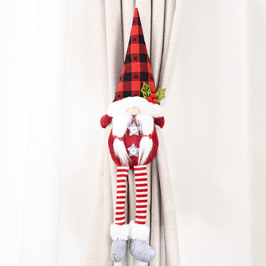 Santa Claus curtain buckle with a black and white buffalo plaid hat, white beard, and red body holding a blue curtain. - Image 16