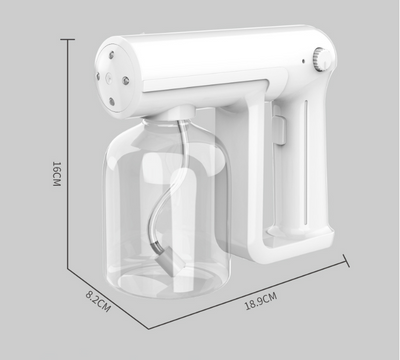 Black wireless alcohol blue light disinfection spray gun with clear reservoir, actively misting, on a marble surface. - Image 7