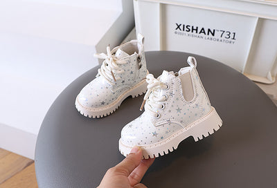 White toddler girls' boots with a holographic star pattern, lace-up front, and side zipper closure. - Image 32