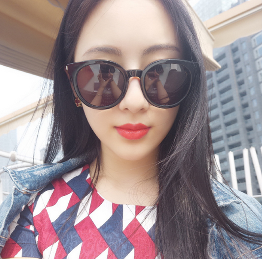 Black vintage square sunglasses for women with round blue mirrored lenses and gold-tone temple accents. - Image 2