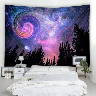 Starry night tapestry with swirling blue, purple, and pink galaxy over a dark pine forest silhouette.