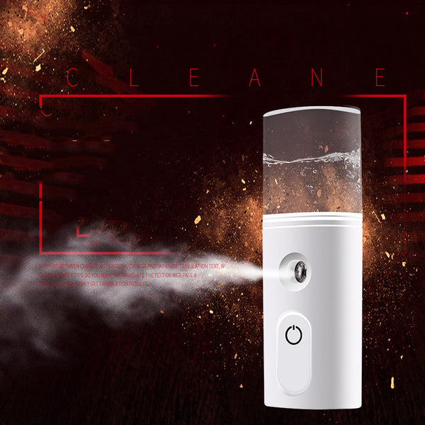 White portable facial humidifier with a clear water tank and a power button, for on-the-go moisturizing.