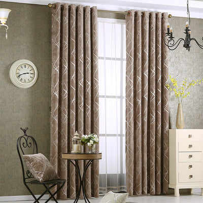 Gray chenille blackout curtains with a subtle silver geometric pattern, hung on a gold rod in a modern living room. - Image 4