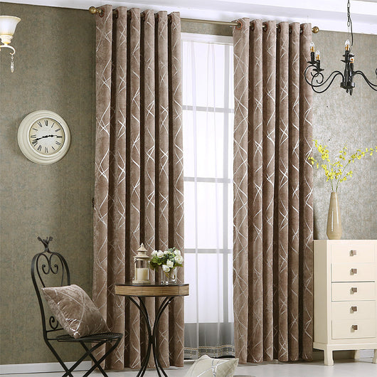 Gray chenille blackout curtains with a subtle silver geometric pattern, hung on a gold rod in a modern living room. - Image 4